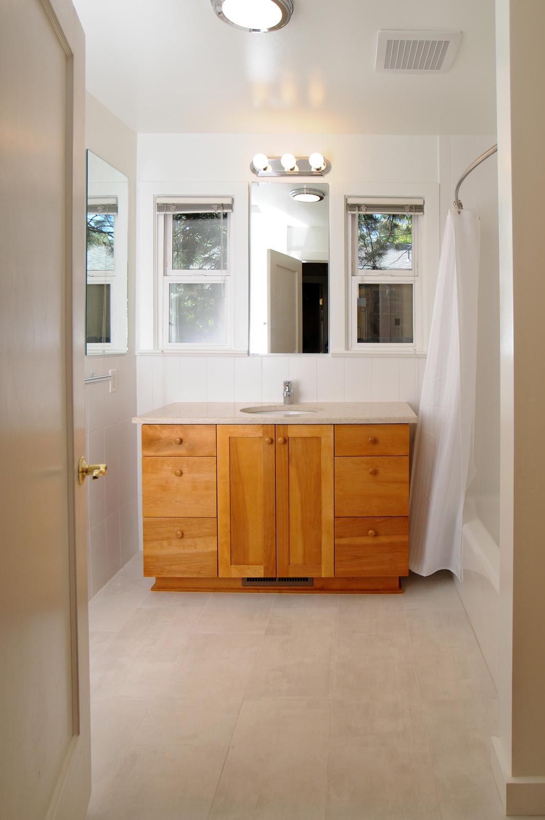 custom master bath sink and cabinet, tiled flooring