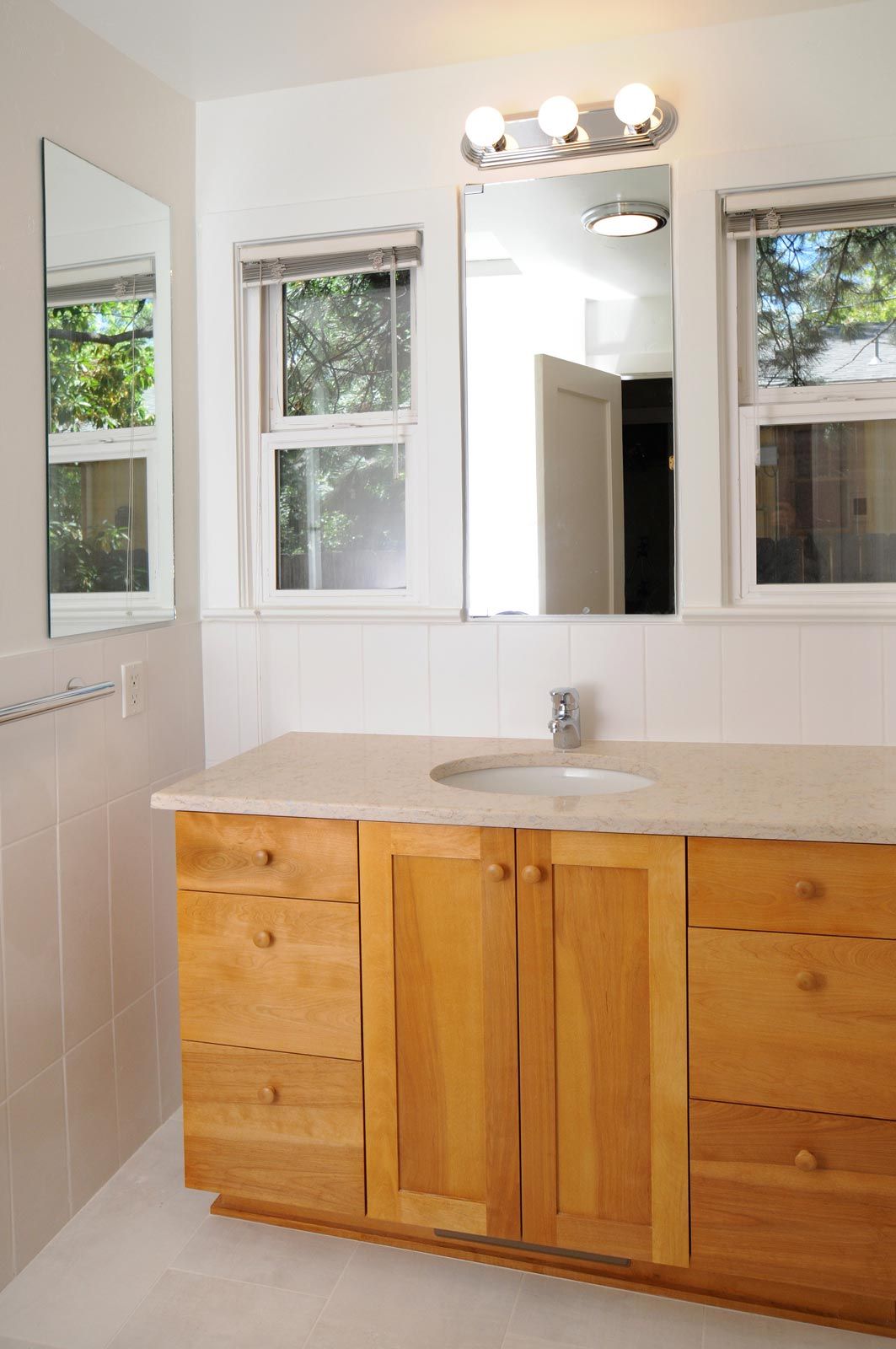 custom master bath sink, cabinet and tiled walls and floors