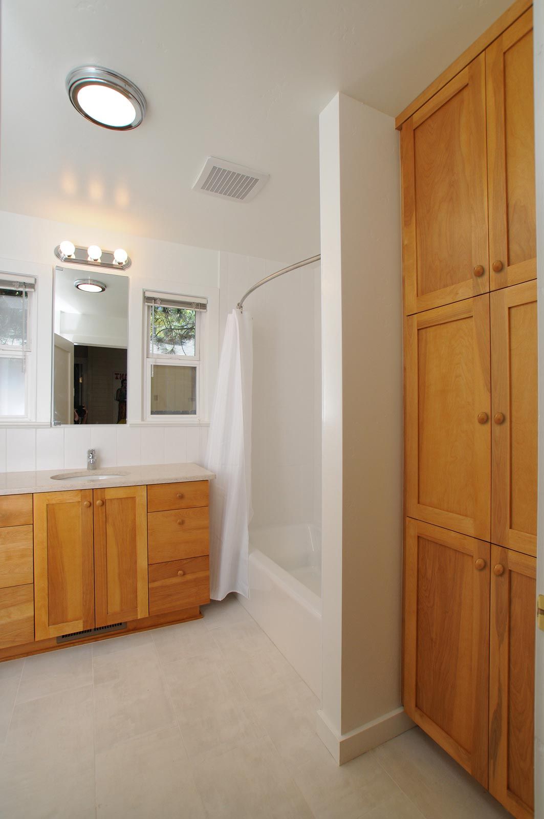custom master bath cabinetry and tiled floor