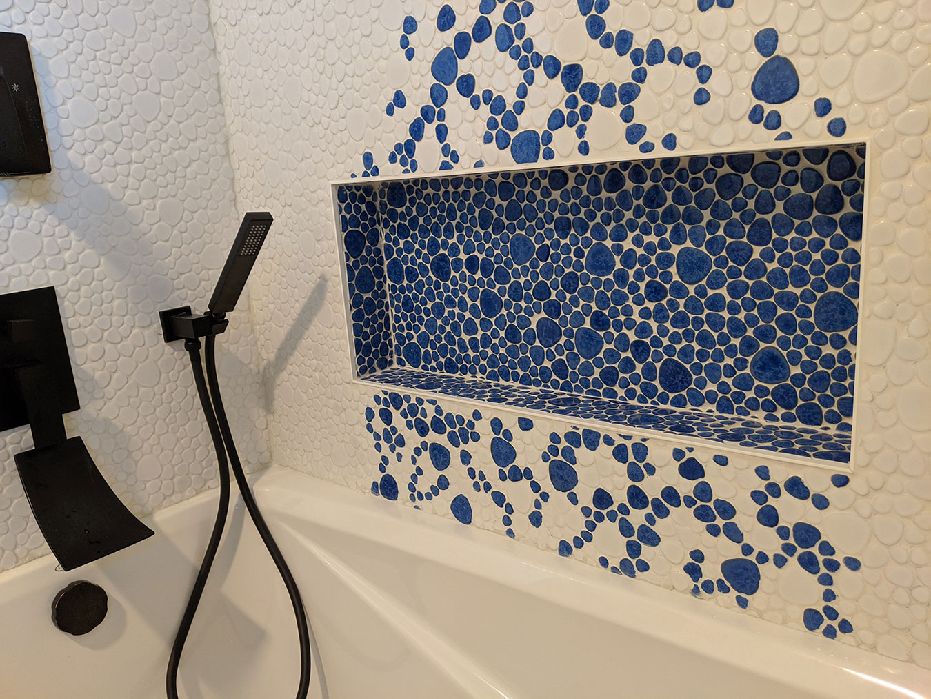 custom bathroom tile with inset shelf