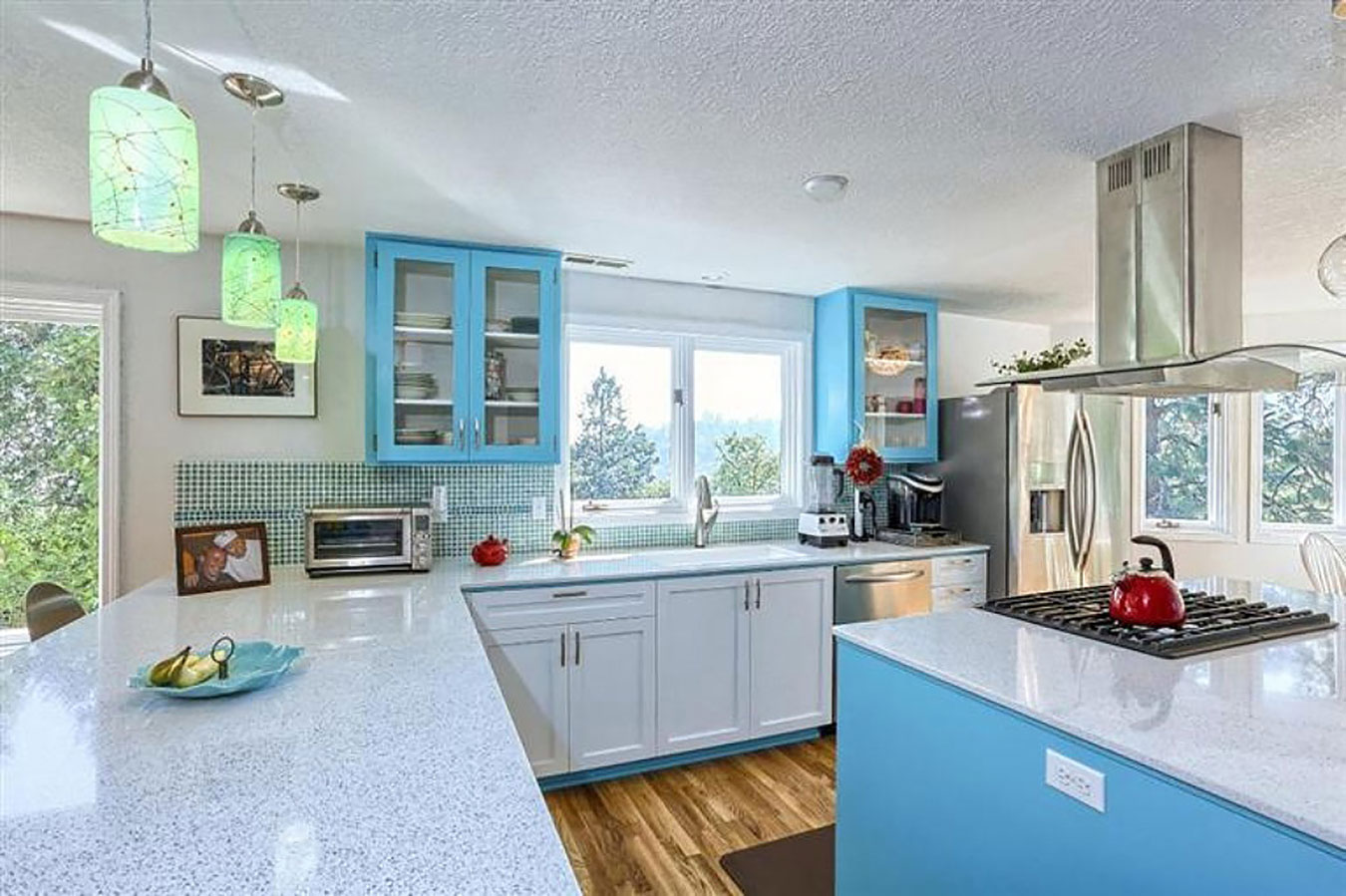 custom kitchen remodel with blue and white cabinets and stone counters